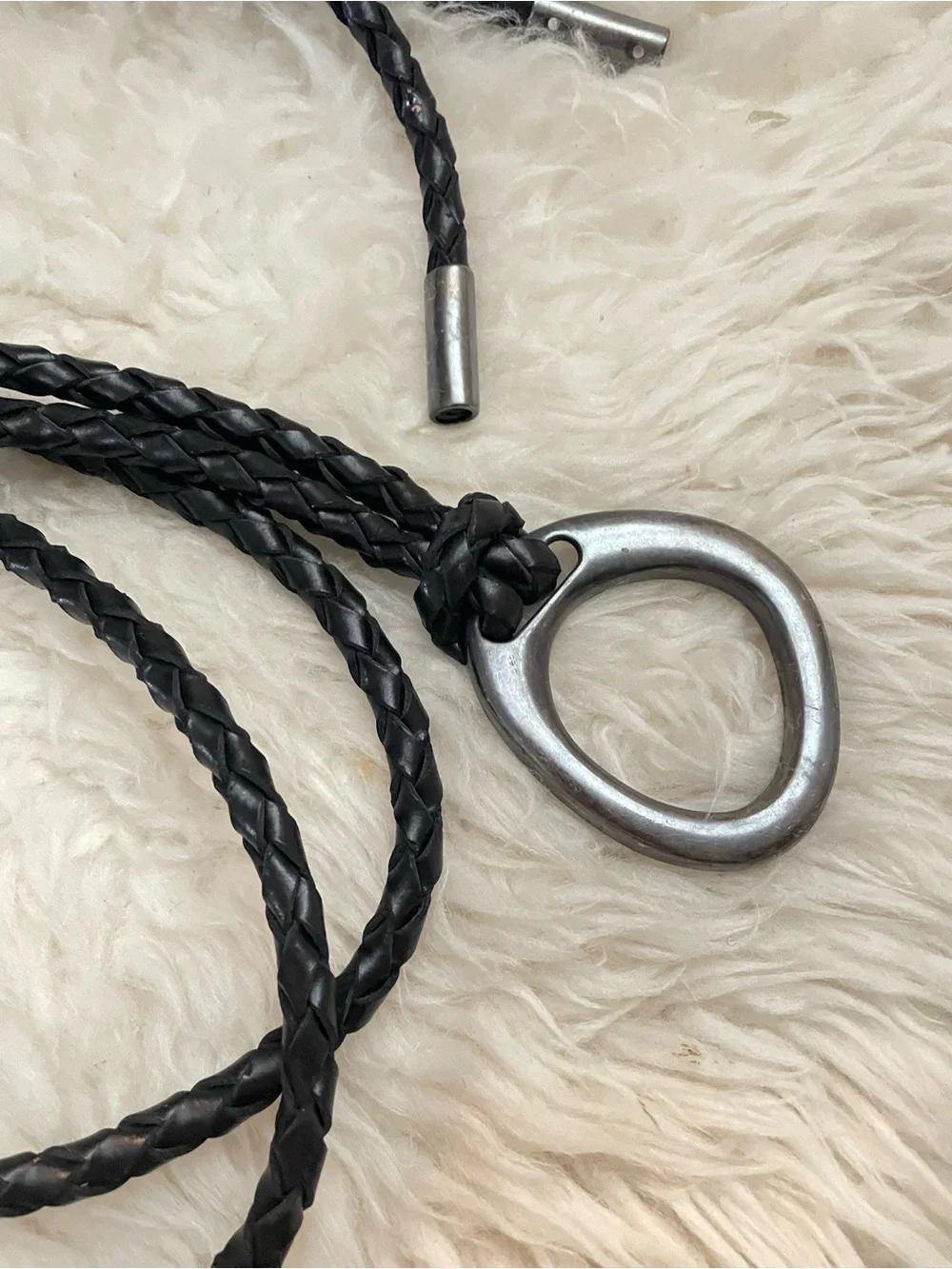 Braided black wrap around belt with a pewter ring buckle